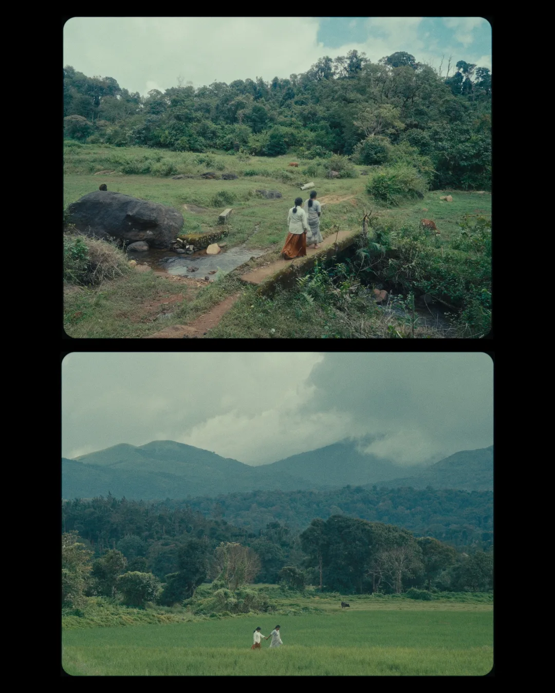 Two small figures cross a forest stream seen from above; below, a range of mist-covered blue hills.